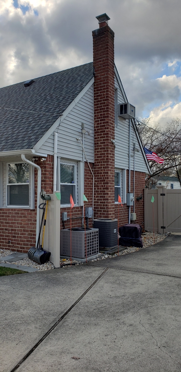 Professional chimney repointing restoring brick joints in Jericho, NY